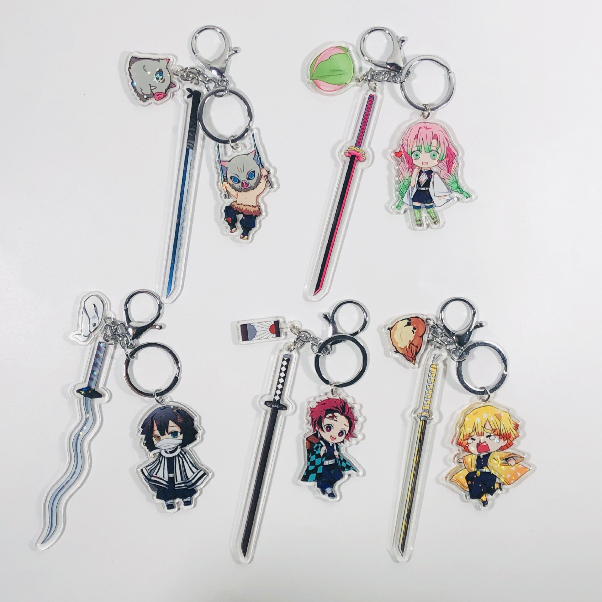 Demon Slayer – Different Characters Themed Keychains with Swords (20+ Designs) Keychains